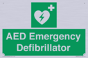 green-background-with-white-text-and-heart-defibrillator-symbol--white-cross-and~
